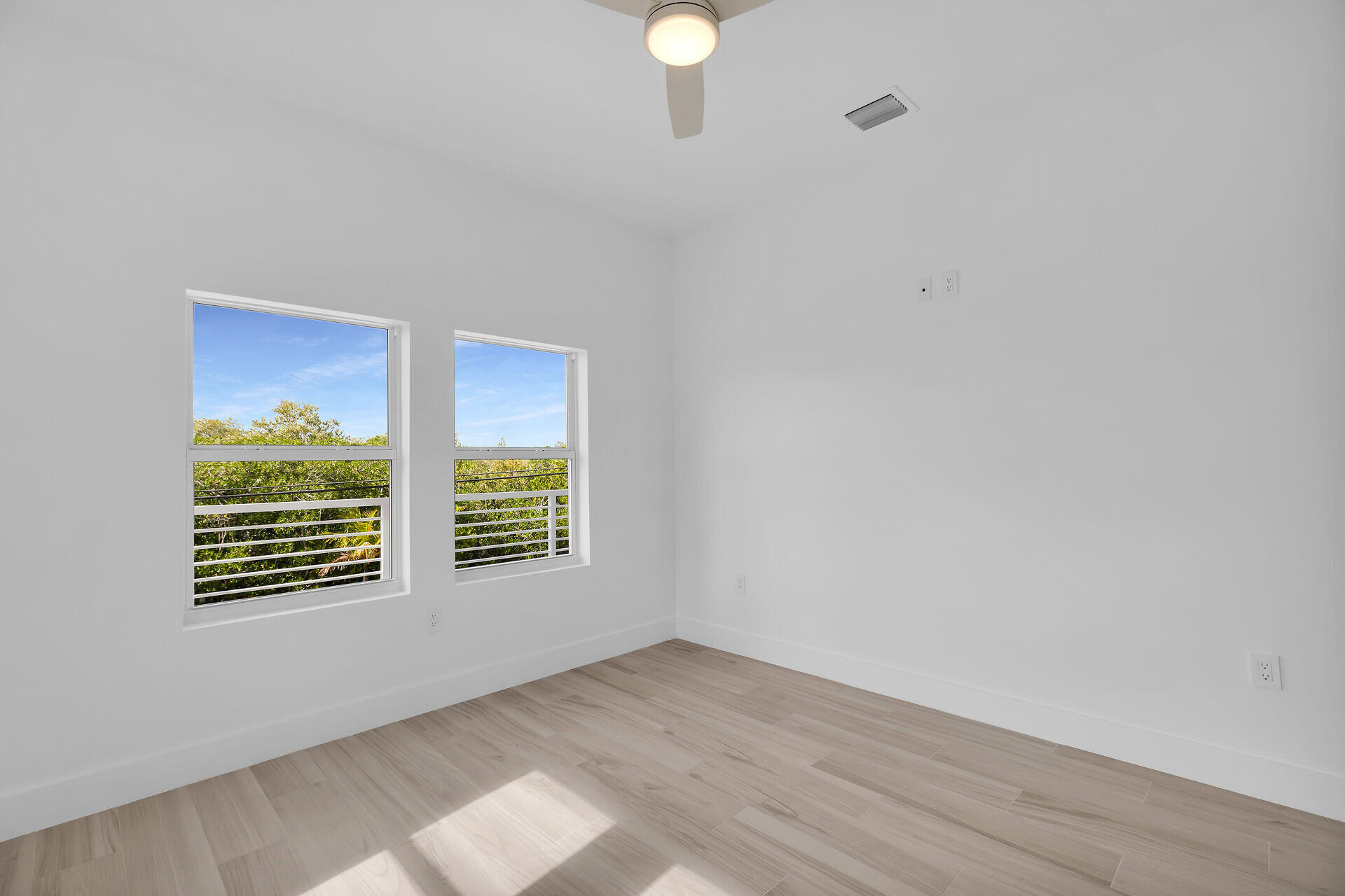 1508 Shaw Drive Key Largo, FL 33037 - Photo 31 of 68 a view of an empty room with wooden floor and a window