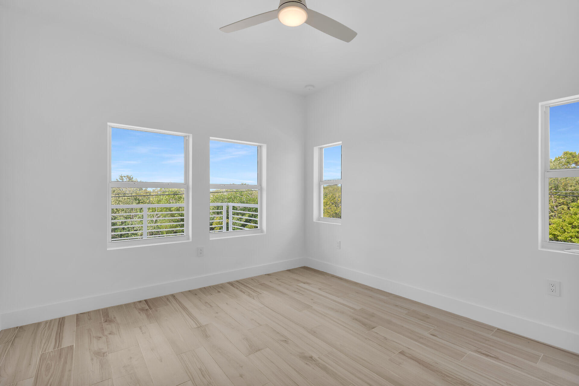 1508 Shaw Drive Key Largo, FL 33037 - Photo 39 of 68 an empty room with wooden floor and windows