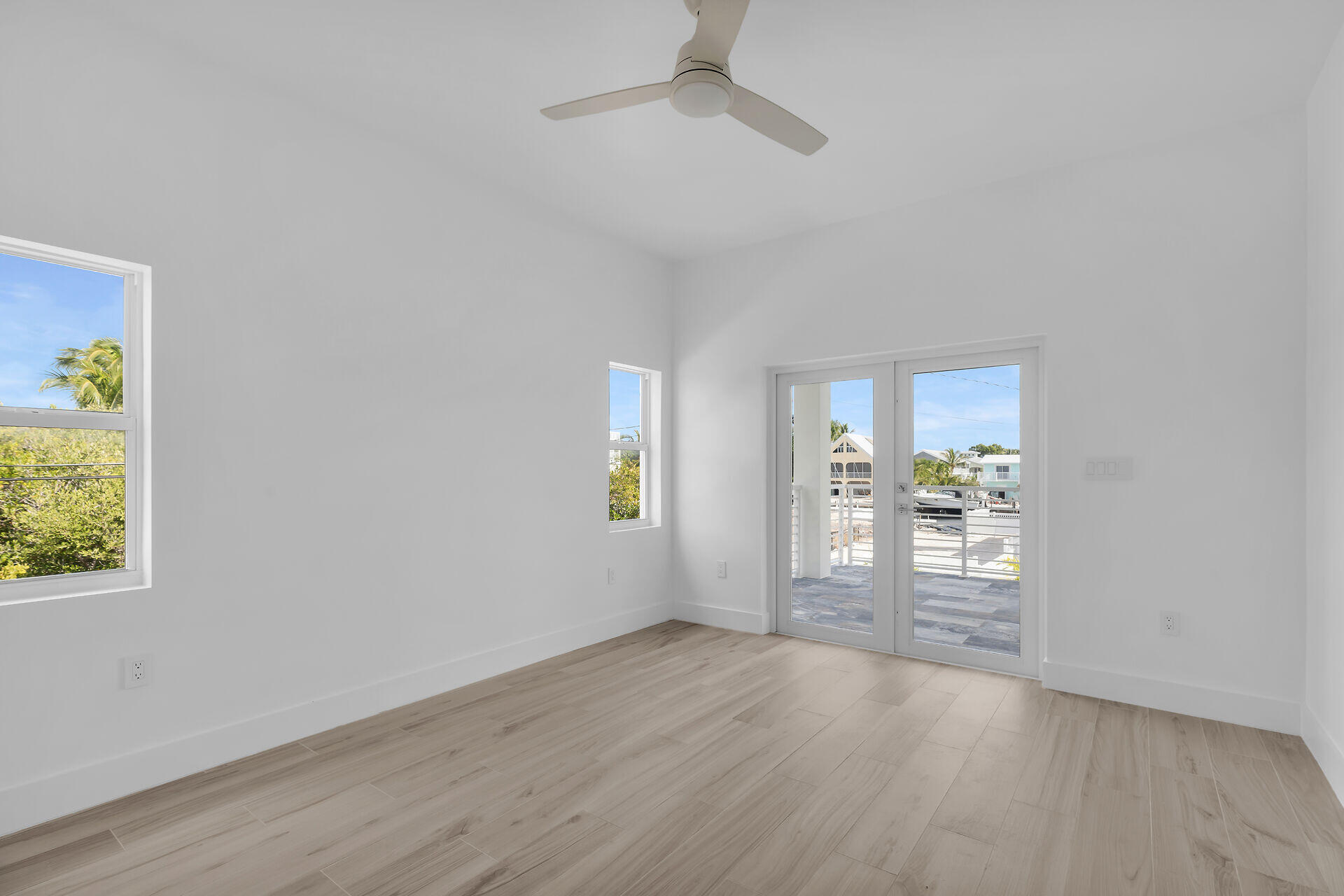 1508 Shaw Drive Key Largo, FL 33037 - Photo 40 of 68 wooden floor in an empty room with a window