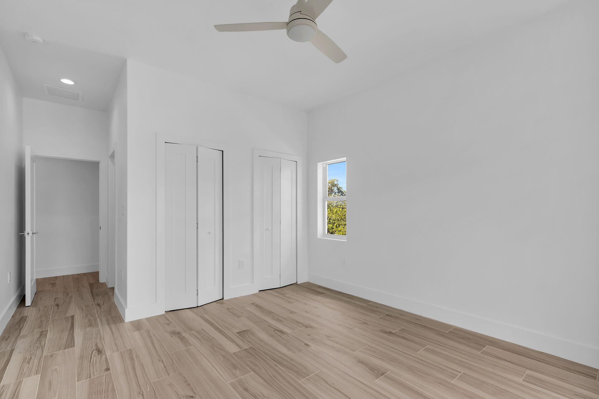 1508 Shaw Drive Key Largo, FL 33037 - Photo 41 of 68 a view of an empty room with a window and wooden floor