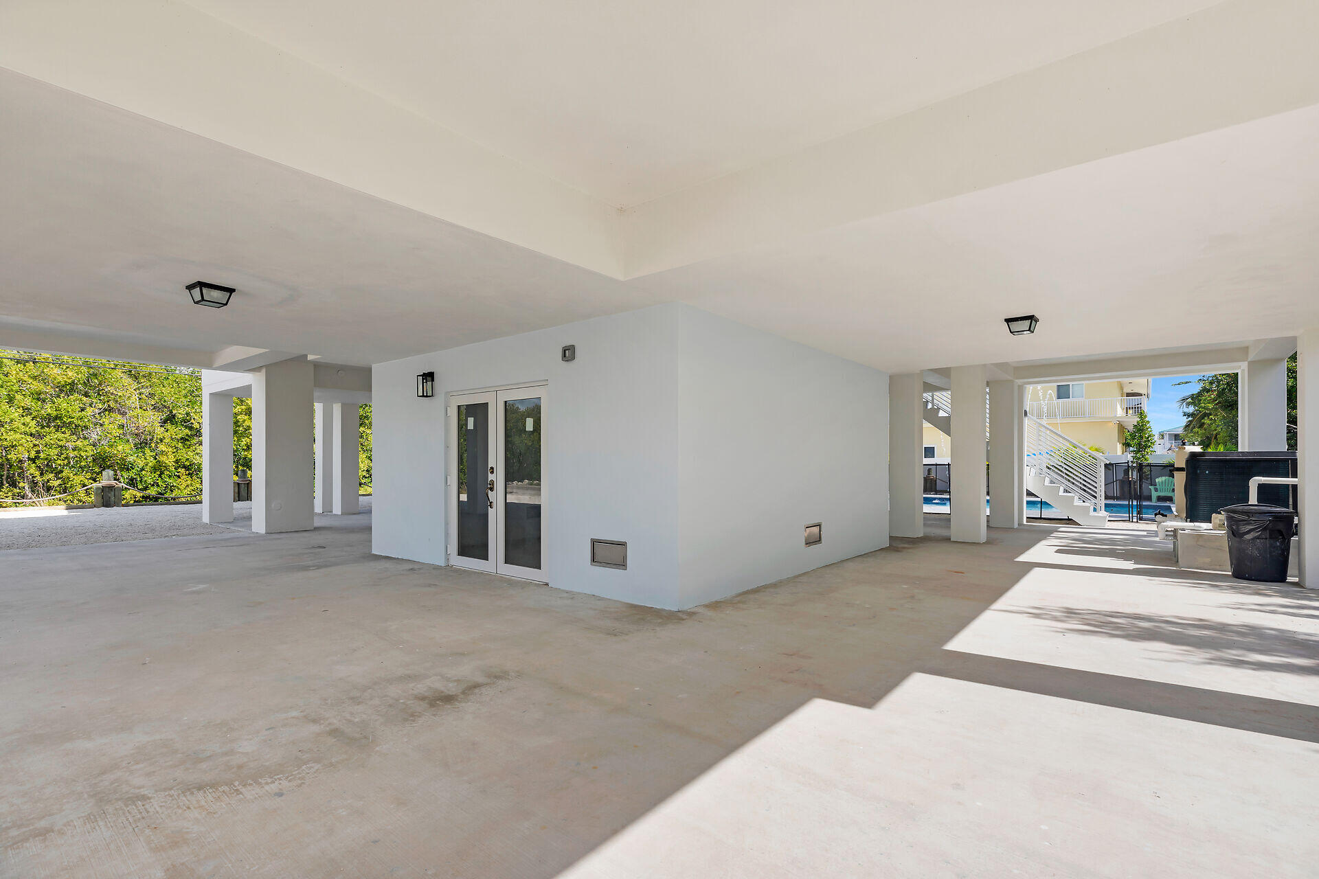 1508 Shaw Drive Key Largo, FL 33037 - Photo 48 of 68 a view of a house with a porch and garden