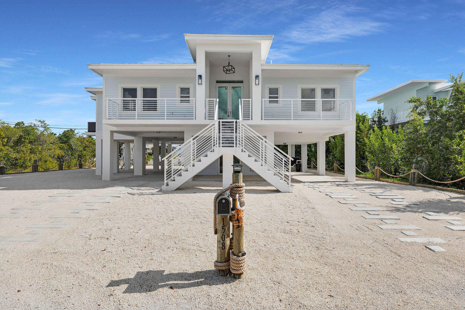 1508 Shaw Drive Key Largo, FL 33037 - Photo 52 of 68 front view of a house with a street