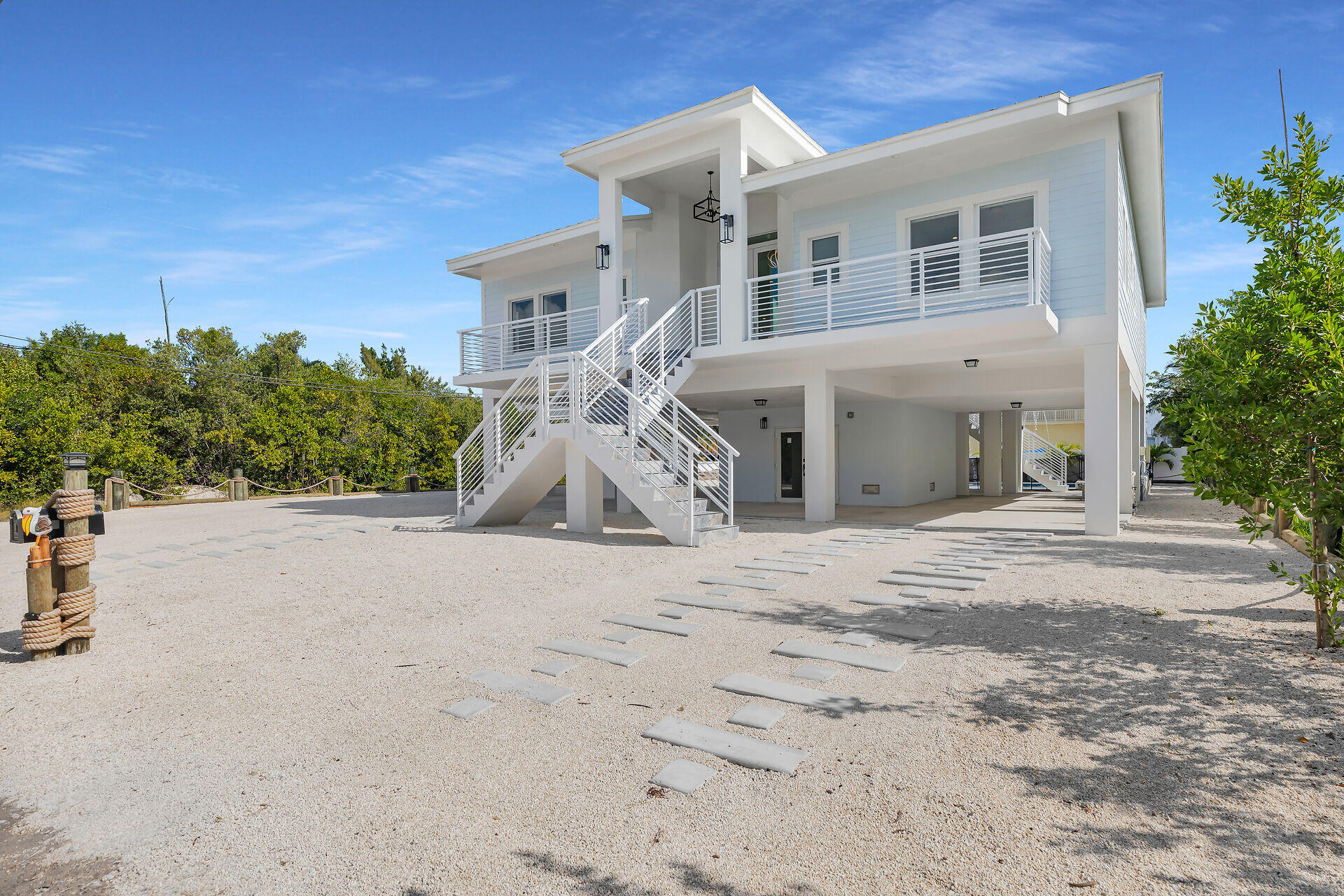 1508 Shaw Drive Key Largo, FL 33037 - Photo 53 of 68 front view of a house with a yard