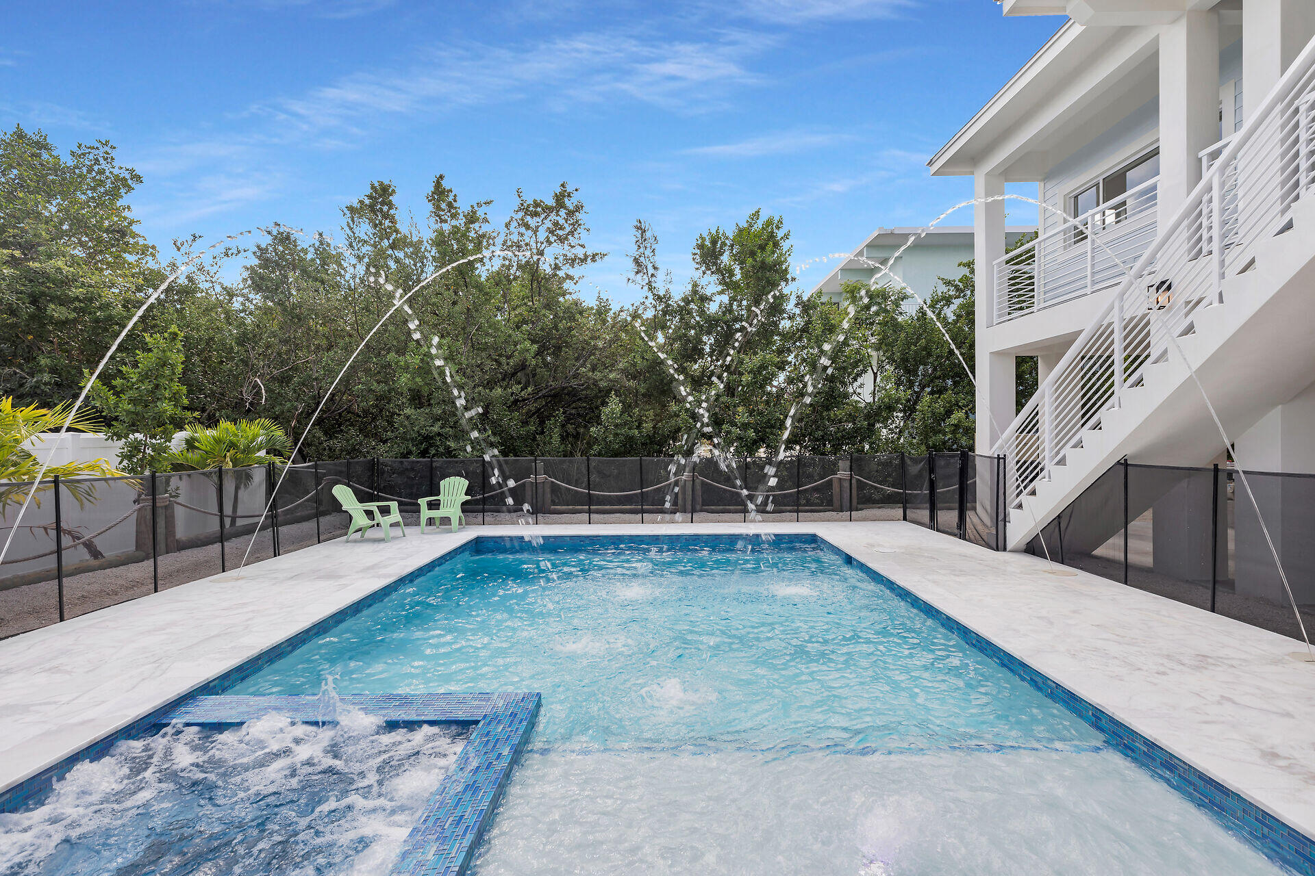 1508 Shaw Drive Key Largo, FL 33037 - Photo 57 of 68 a view of a swimming pool with lounge chair