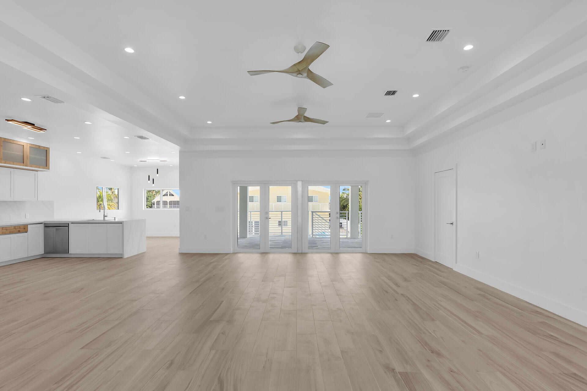1508 Shaw Drive Key Largo, FL 33037 - Photo 7 of 68 a view of an empty room with a window and wooden floor