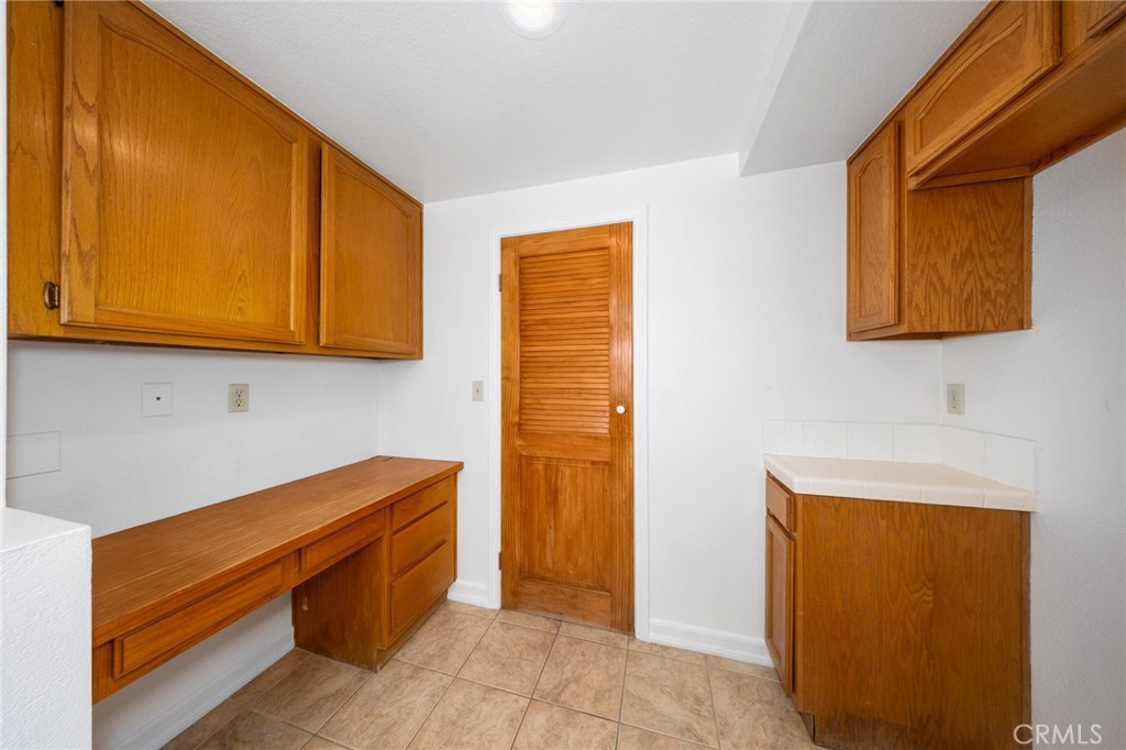 30030 Corte Cantera Temecula, CA 92591 - Photo 17 of 41 Pantry and Fridge Area