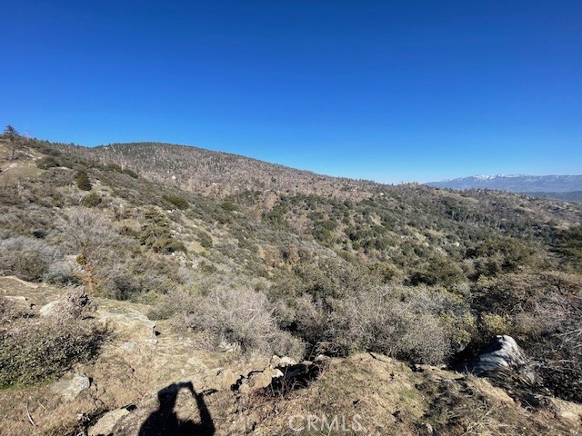 27251 Deertrail Drive Tehachapi, CA 93561 - Photo 7 of 22 a view of a large building with mountains in the background