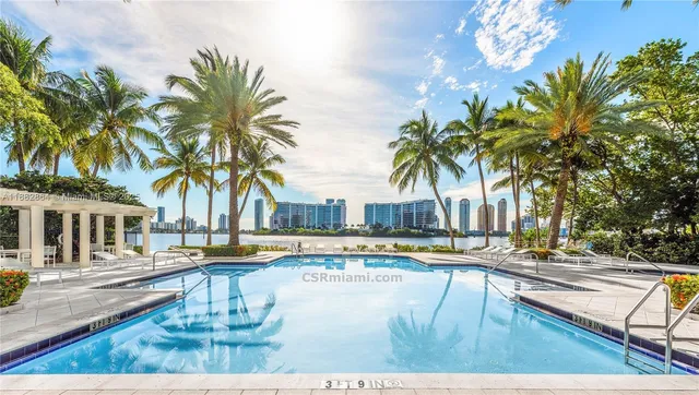 a swimming pool with outdoor seating and yard