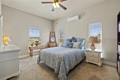 a bedroom with a bed and window