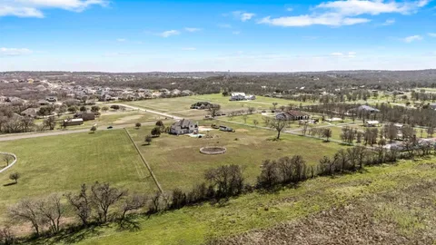 an aerial view of residential building and lake