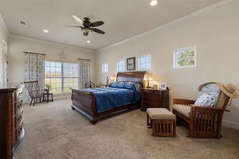 a bedroom with furniture and a window