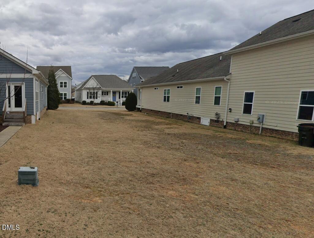 1022 Branch Line Lane Apex, NC 27502 - Photo 3 of 4 a big house with a big yard and large trees
