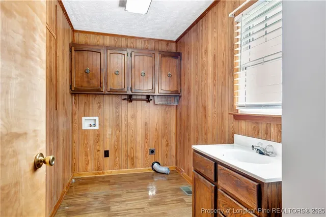 a bathroom with a sink a mirror and a shower