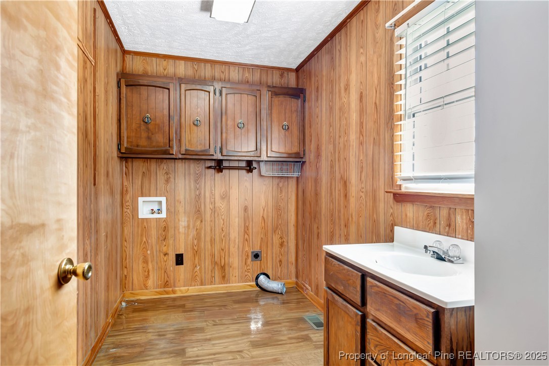 725 Henry Hammond Road Lumberton, NC 28360 - Photo 19 of 42 a bathroom with a sink a mirror and a shower