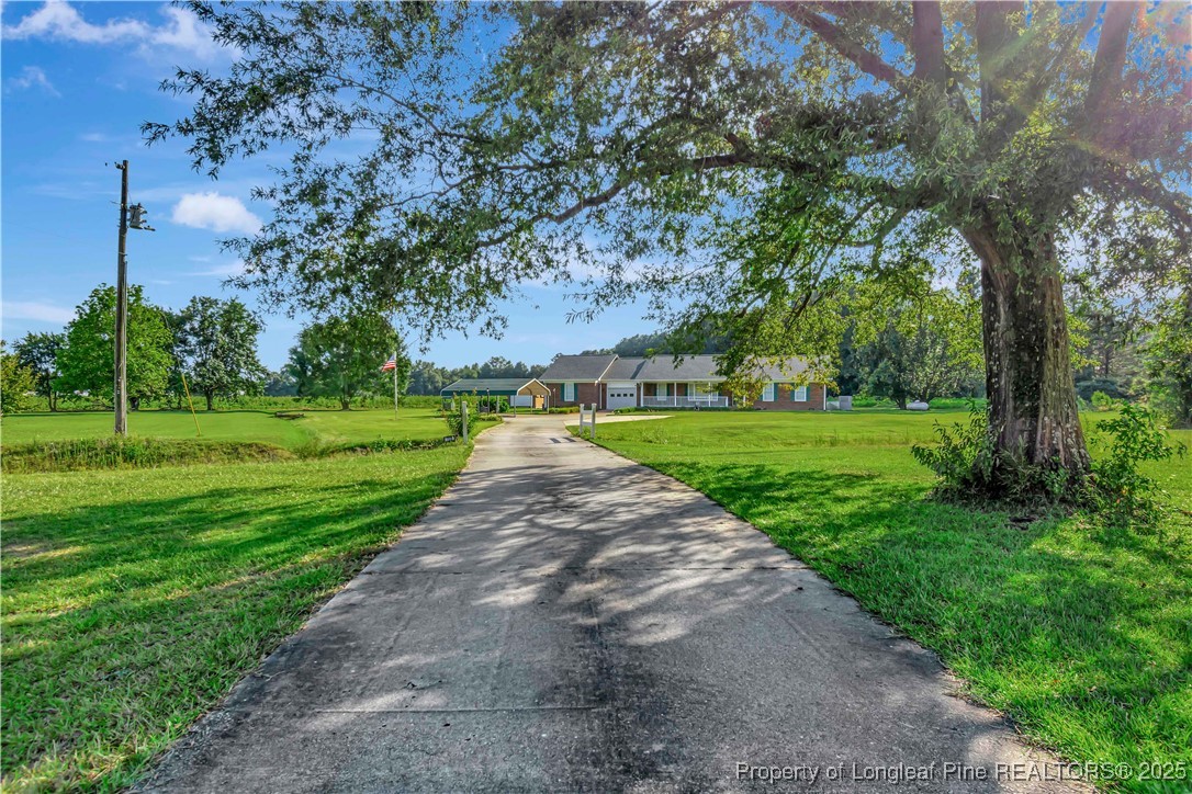 725 Henry Hammond Road Lumberton, NC 28360 - Photo 2 of 42 a view of a park with large trees