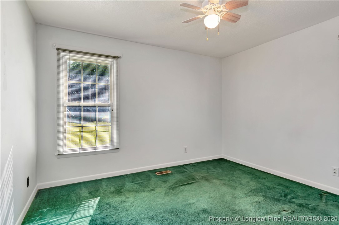725 Henry Hammond Road Lumberton, NC 28360 - Photo 28 of 42 an empty room with a window