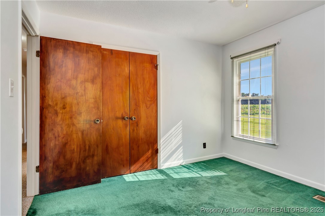 725 Henry Hammond Road Lumberton, NC 28360 - Photo 29 of 42 an empty room with windows