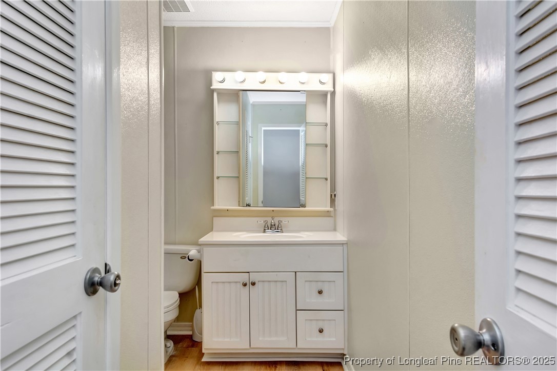725 Henry Hammond Road Lumberton, NC 28360 - Photo 32 of 42 a bathroom with a sink and a mirror