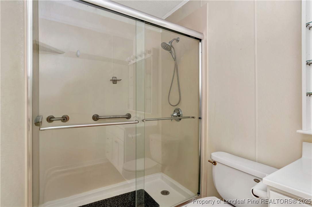 725 Henry Hammond Road Lumberton, NC 28360 - Photo 33 of 42 a bathroom with a shower and toilet