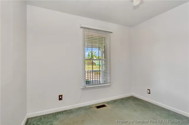 a view of a house with backyard and porch