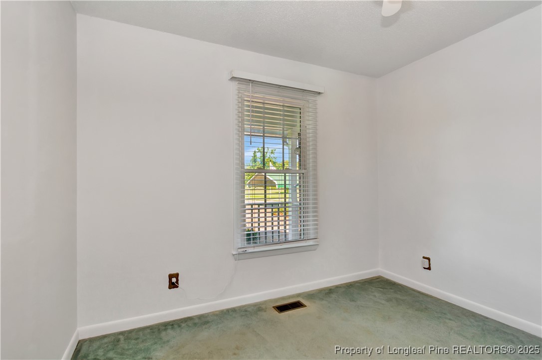 725 Henry Hammond Road Lumberton, NC 28360 - Photo 34 of 42 an empty room with a window