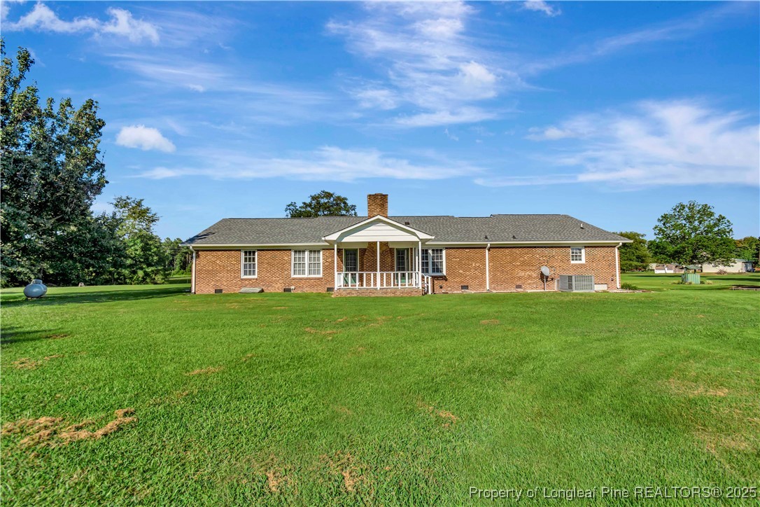 725 Henry Hammond Road Lumberton, NC 28360 - Photo 36 of 42 a front view of a house with a garden