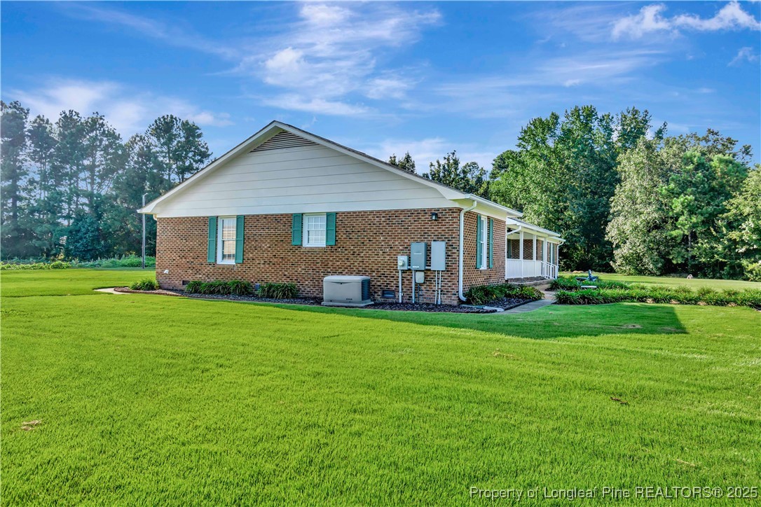 725 Henry Hammond Road Lumberton, NC 28360 - Photo 38 of 42 a front view of house with yard and green space