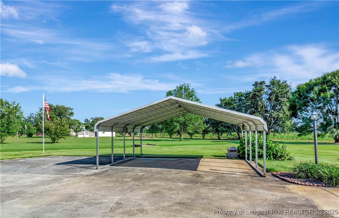 725 Henry Hammond Road Lumberton, NC 28360 - Photo 39 of 42 a view of a park with swings and slides