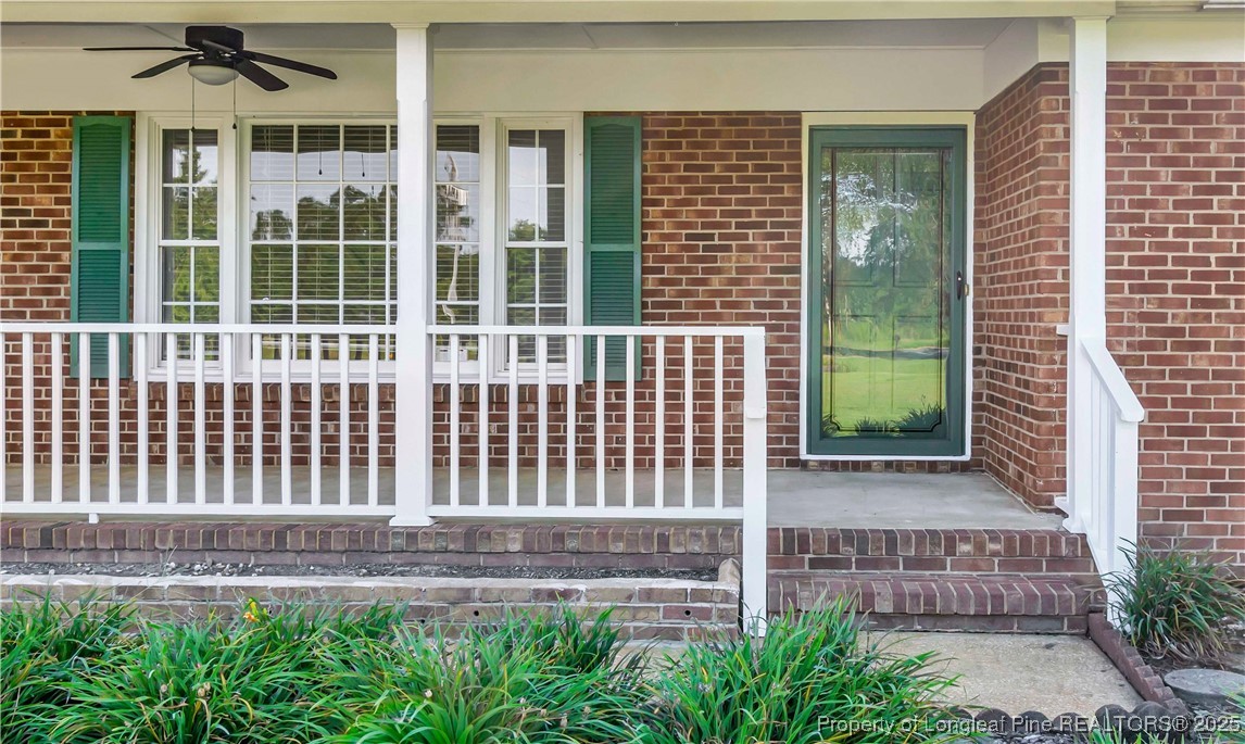 725 Henry Hammond Road Lumberton, NC 28360 - Photo 5 of 42 a view of a house with a small yard and wooden fence