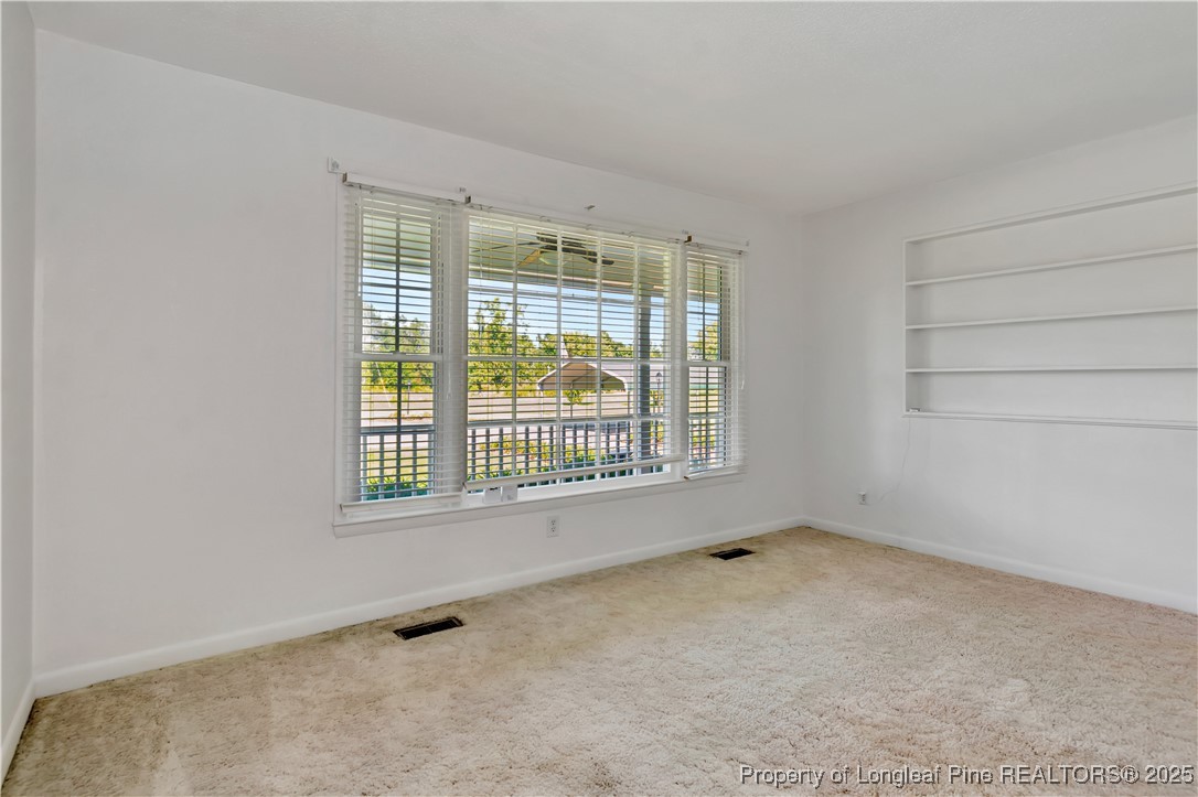 725 Henry Hammond Road Lumberton, NC 28360 - Photo 9 of 42 a view of an empty room with a window