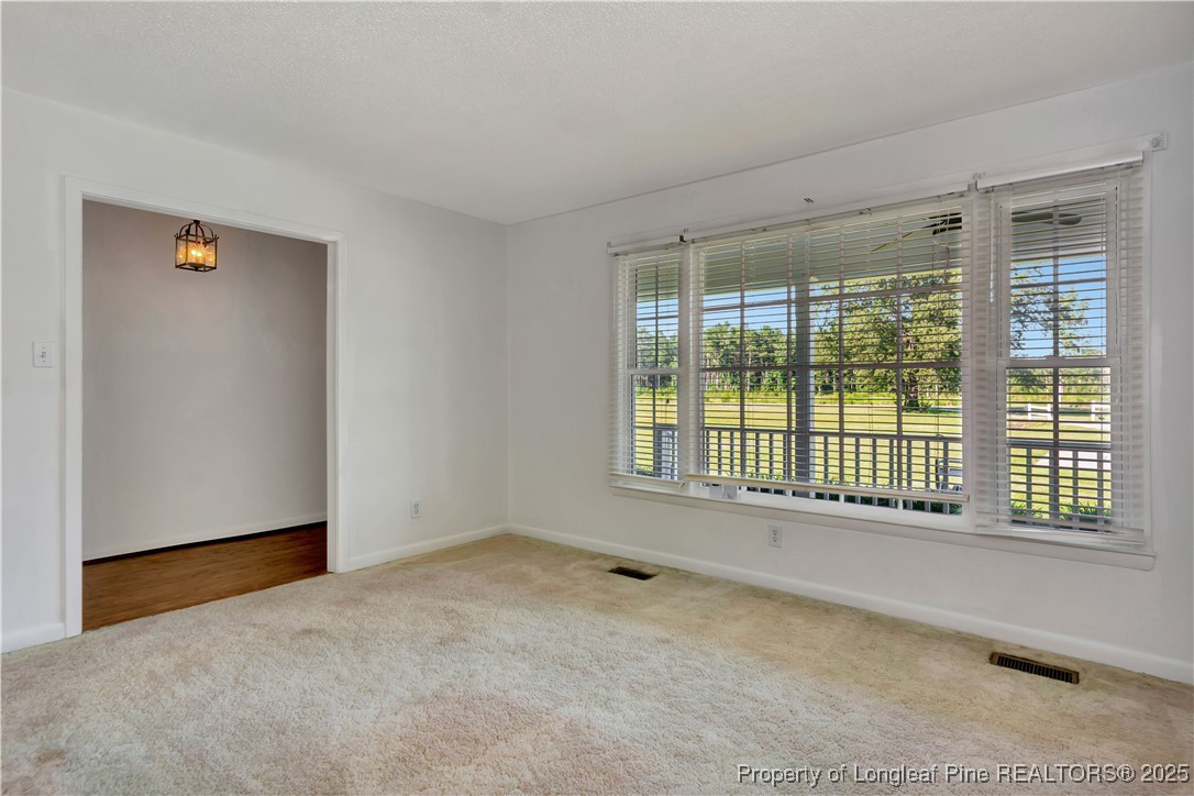 725 Henry Hammond Road Lumberton, NC 28360 - Photo 10 of 42 a view of an empty room with a window
