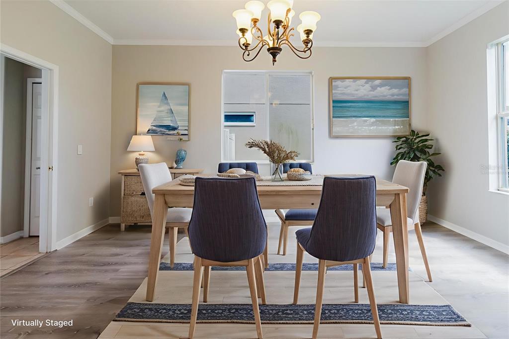 1725 Pink Guara Court Trinity, FL 34655 - Photo 13 of 100 a dining room with furniture a rug and wooden floor
