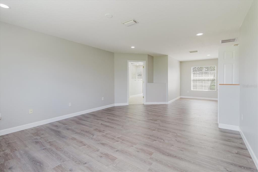 1725 Pink Guara Court Trinity, FL 34655 - Photo 53 of 100 wooden floor in an empty room with a window