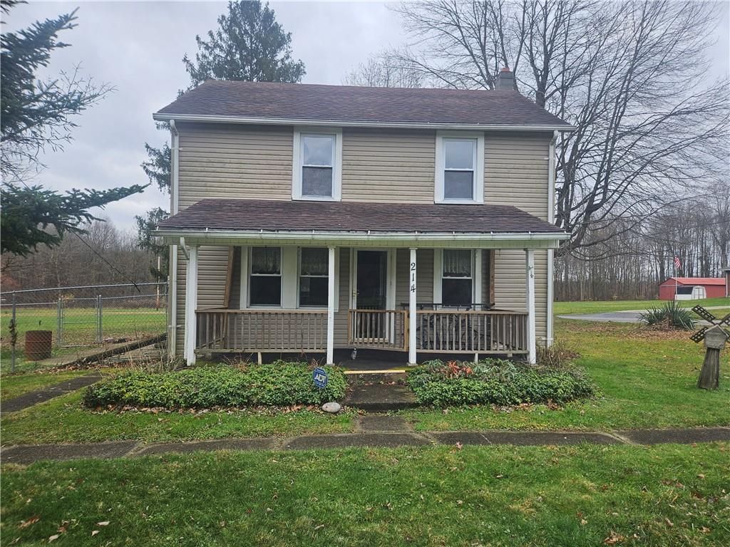 214 Bestwick Road Mercer, PA 16137 - Photo 1 of 19 a brick house with garden in front of it