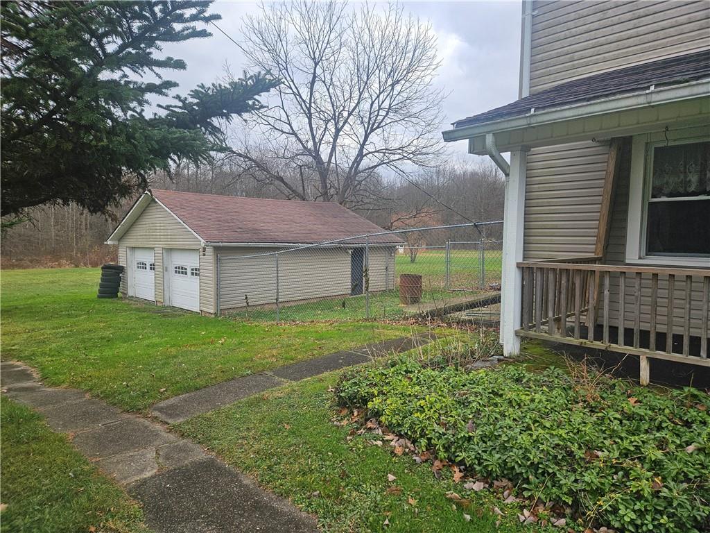 214 Bestwick Road Mercer, PA 16137 - Photo 14 of 19 a view of a house with a yard and wooden fence