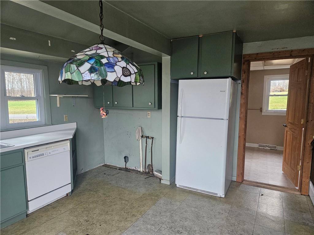 214 Bestwick Road Mercer, PA 16137 - Photo 7 of 19 a kitchen with a refrigerator and a stove