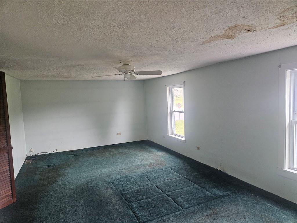 214 Bestwick Road Mercer, PA 16137 - Photo 10 of 19 a view of an empty room with a window