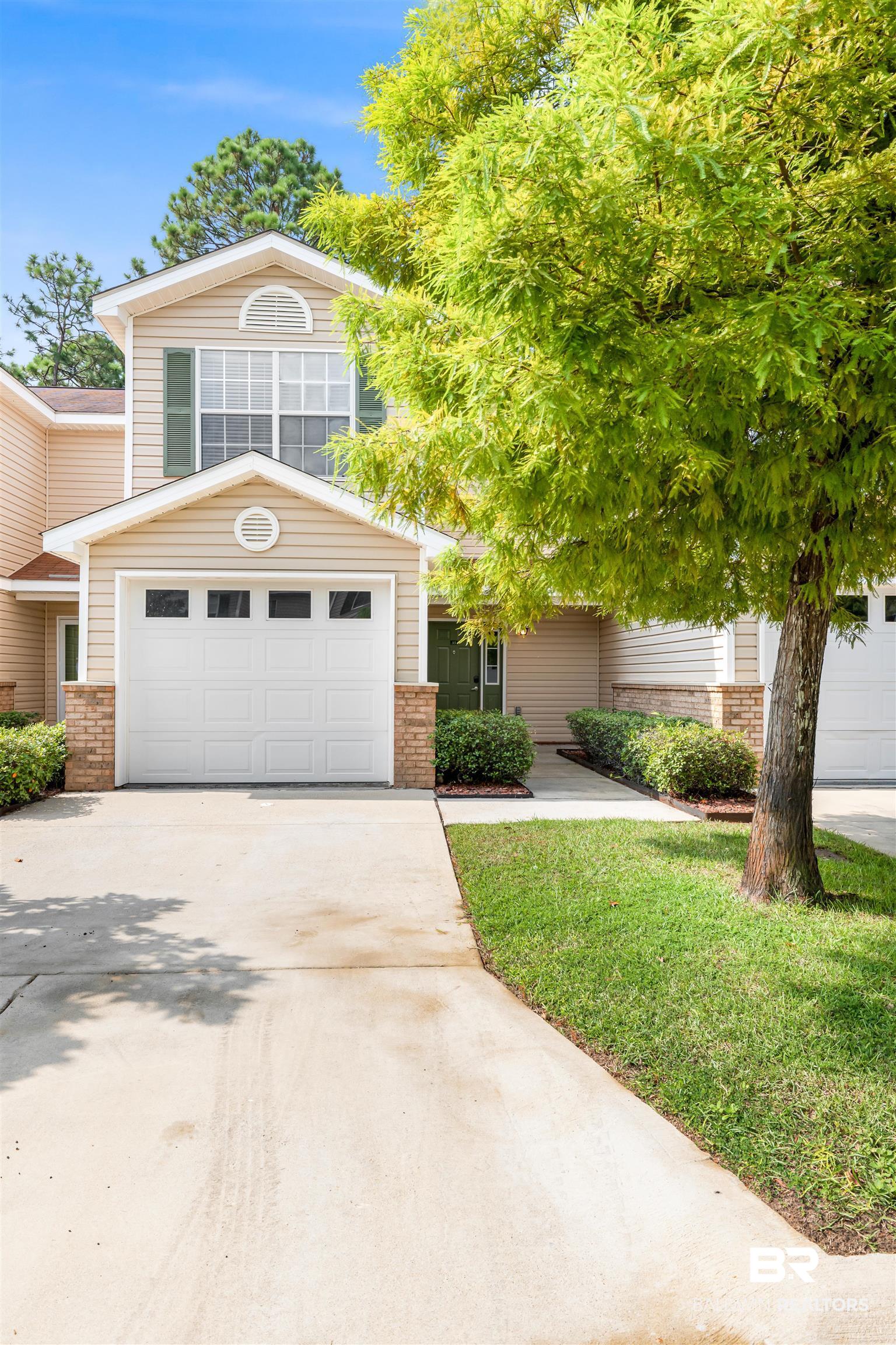 1517 Regency Road, Unit 85 Gulf Shores, AL 36542 - Photo 1 of 32 View of front facade with a garage