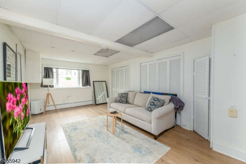 7 Capstan Road West Milford, NJ 07480 - Photo 12 of 33 a living room with furniture and flowers