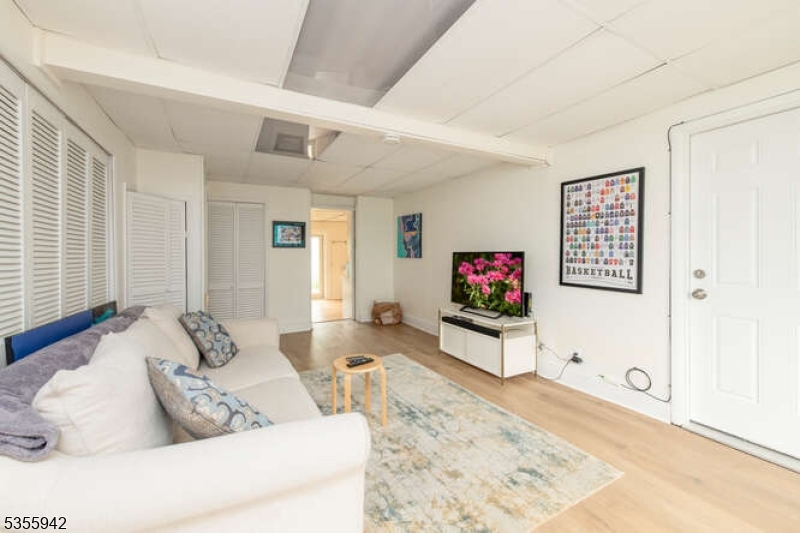 7 Capstan Road West Milford, NJ 07480 - Photo 13 of 33 a living room with furniture and a flat screen tv