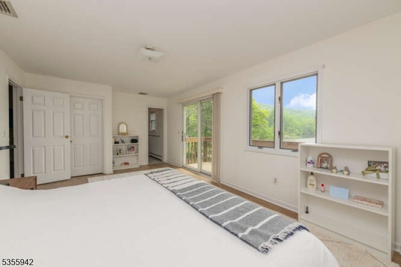 7 Capstan Road West Milford, NJ 07480 - Photo 14 of 33 a spacious bedroom with a bed and a window