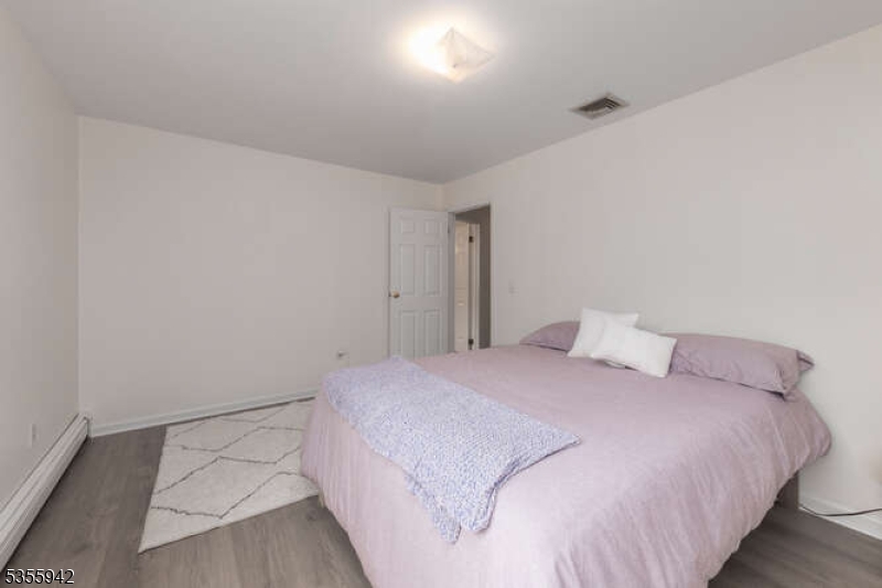 7 Capstan Road West Milford, NJ 07480 - Photo 17 of 33 a bedroom with a bed and a night stand