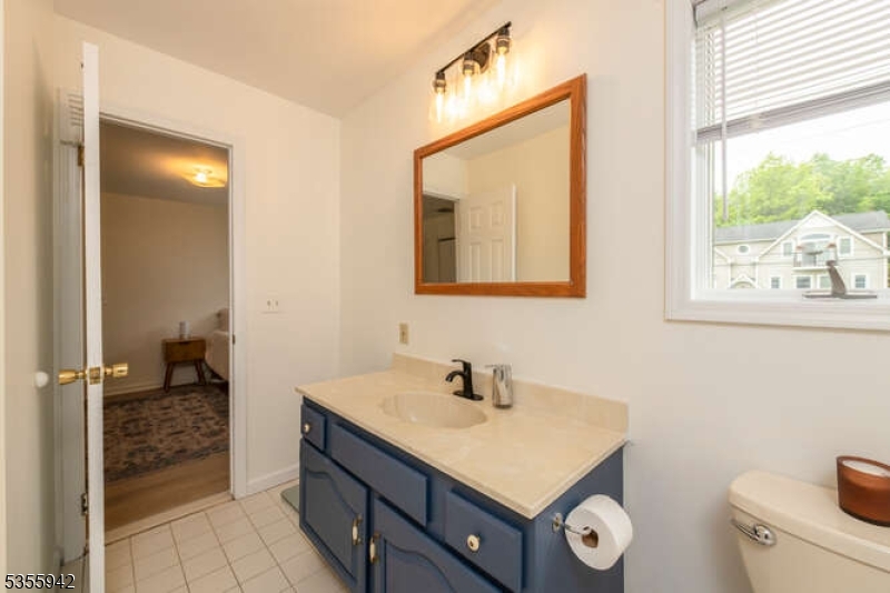 7 Capstan Road West Milford, NJ 07480 - Photo 24 of 33 a bathroom with a sink a toilet and mirror