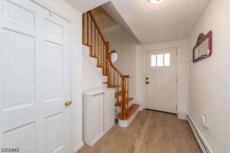 7 Capstan Road West Milford, NJ 07480 - Photo 26 of 33 a view of hallway with stairs and wooden floor