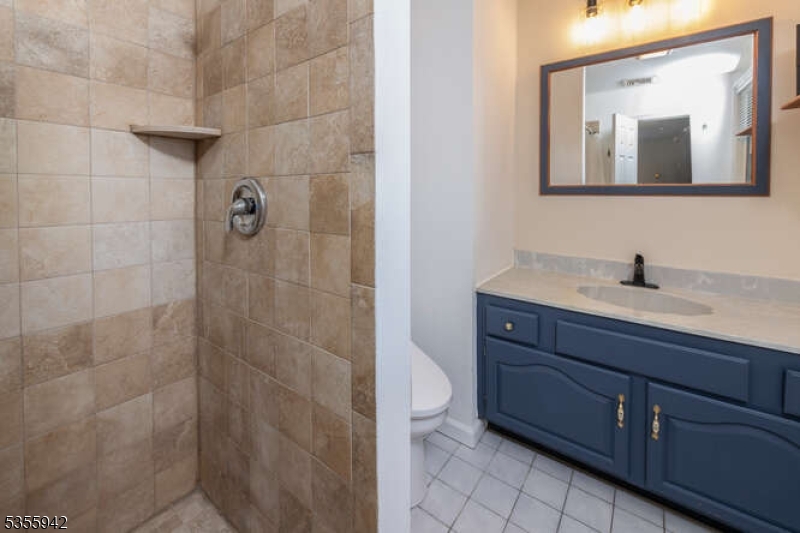 7 Capstan Road West Milford, NJ 07480 - Photo 27 of 33 a bathroom with a toilet a sink and mirror