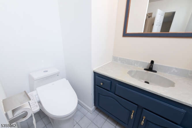 7 Capstan Road West Milford, NJ 07480 - Photo 28 of 33 a bathroom with a toilet a sink and mirror