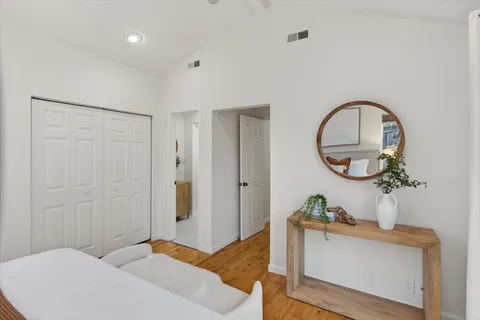 a bedroom with a bed and a dresser