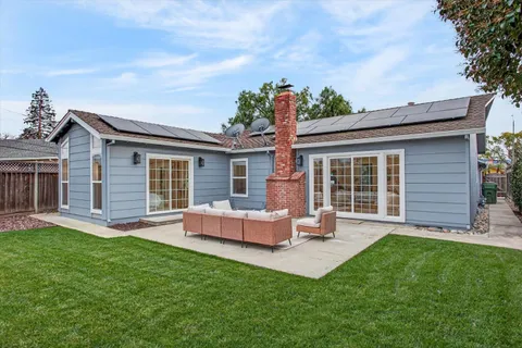 front view of a house with a yard and porch
