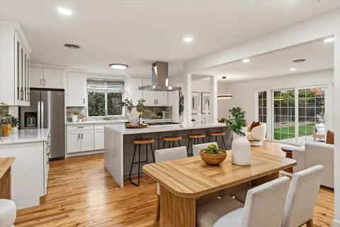 a kitchen with a table and chairs