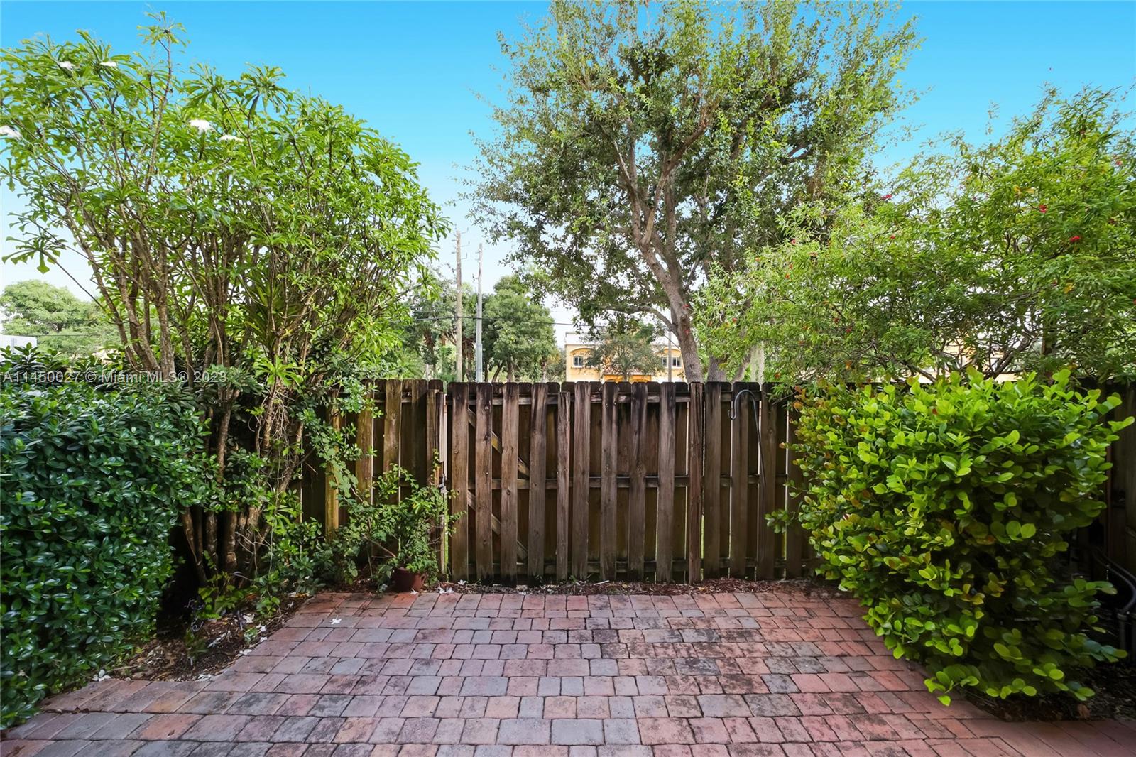 12953 Southwest 132nd Terrace Miami, FL 33186 - Photo 15 of 36 a view of backyard with wooden fence